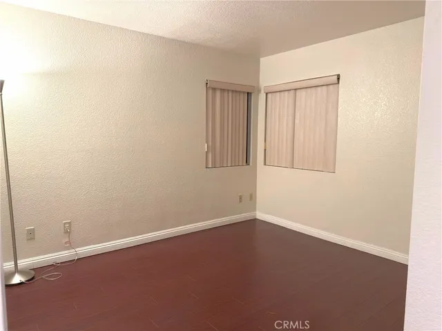 an empty room with a empty space and a window