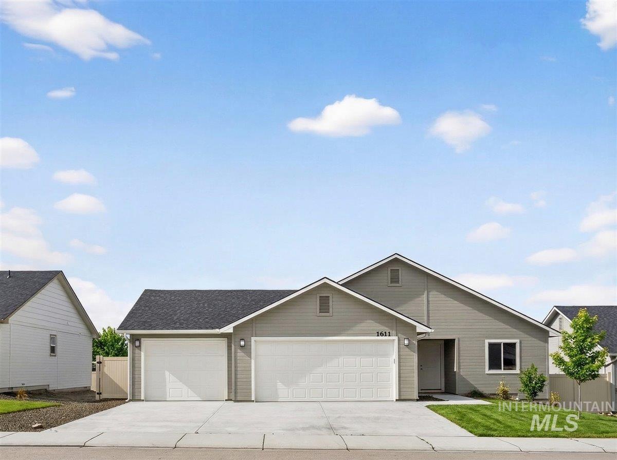 1611 Regency Way Emmett, ID 83617 - Photo 1 of 47 Single story home with a garage, driveway, and roof with shingles