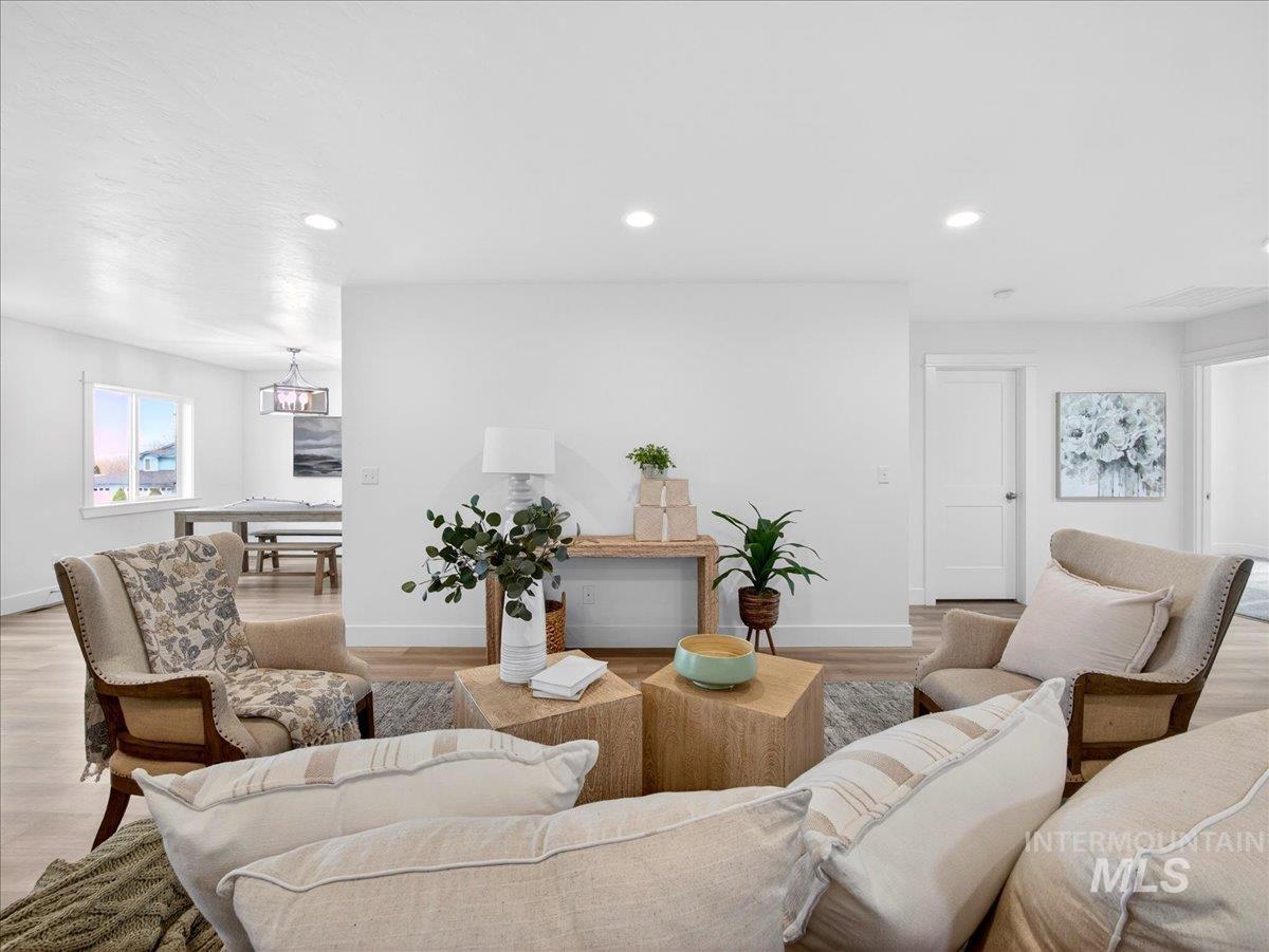1611 Regency Way Emmett, ID 83617 - Photo 11 of 47 Living room featuring wood finished floors and recessed lighting