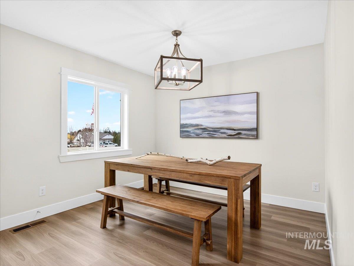 1611 Regency Way Emmett, ID 83617 - Photo 20 of 47 Dining area featuring light wood-style flooring and hanging lights