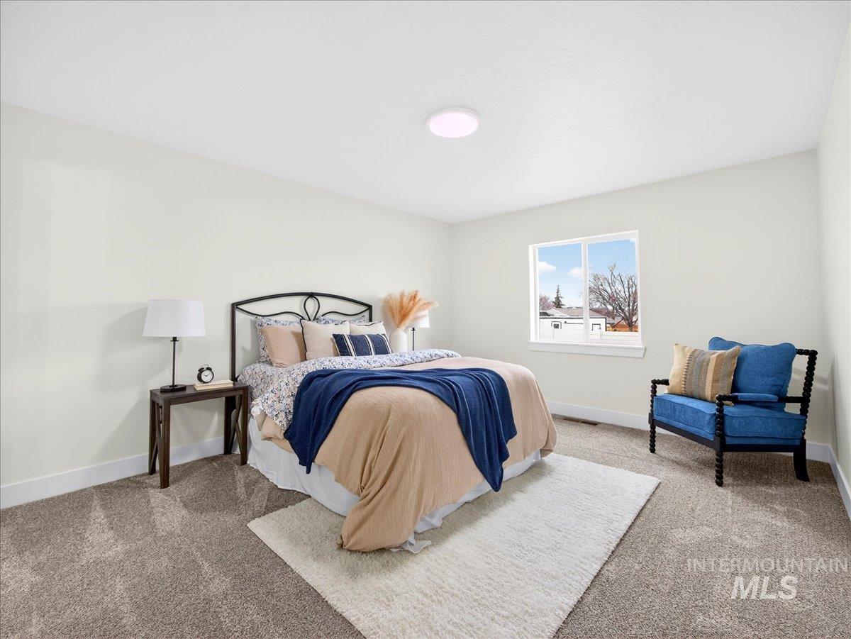 1611 Regency Way Emmett, ID 83617 - Photo 22 of 47 Bedroom with light carpet