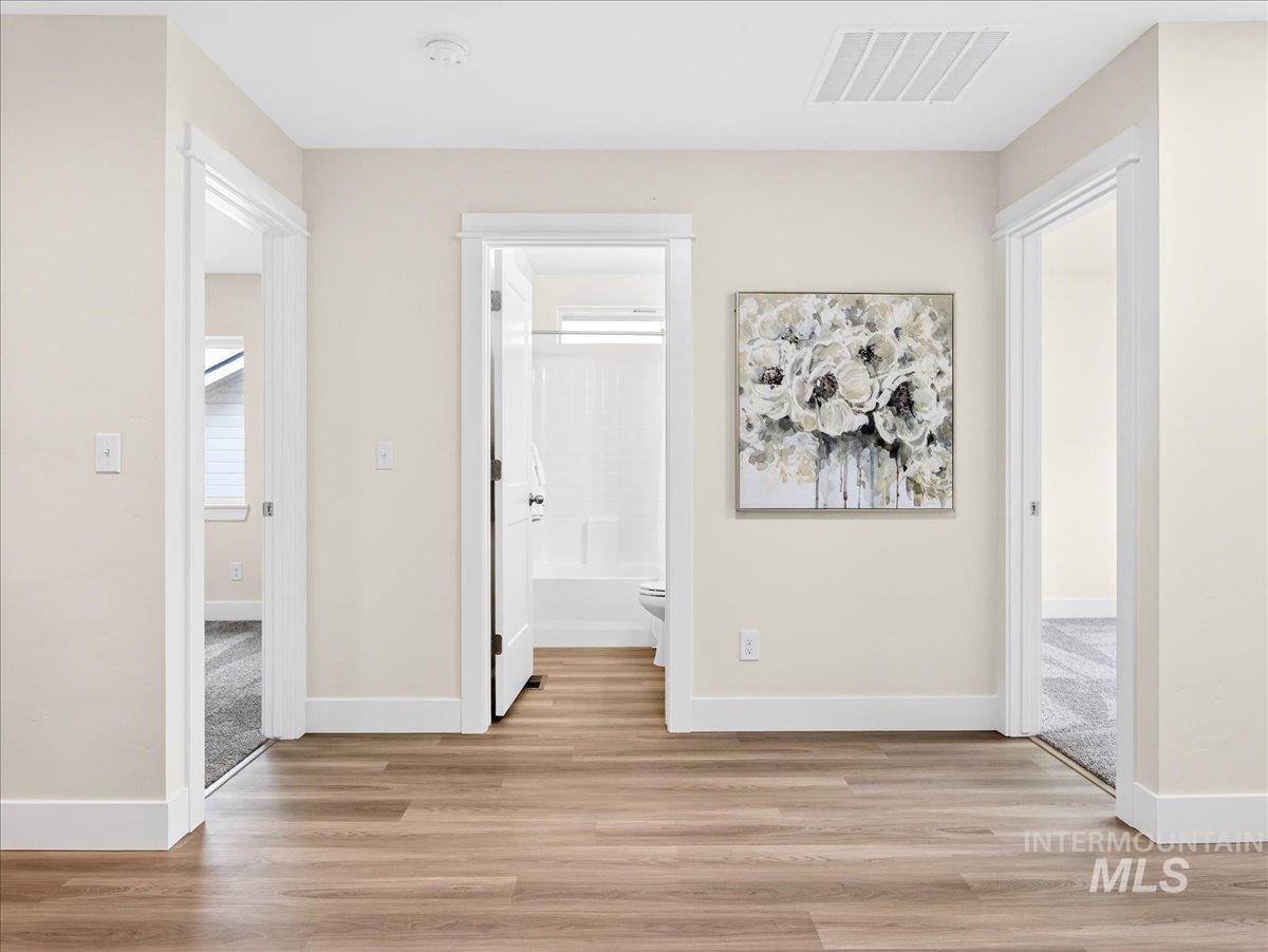 1611 Regency Way Emmett, ID 83617 - Photo 34 of 47 Corridor featuring light wood-type flooring