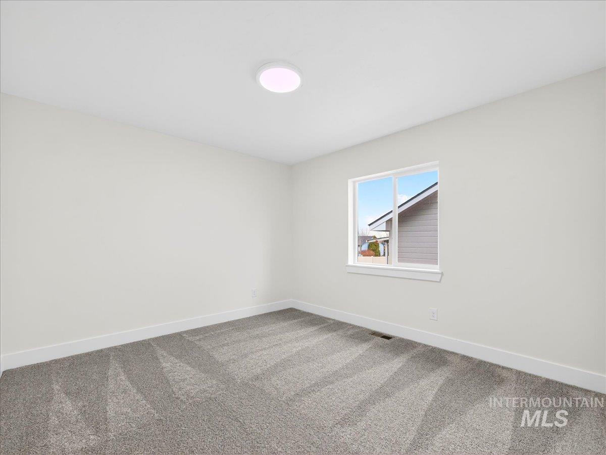 1611 Regency Way Emmett, ID 83617 - Photo 37 of 47 Carpeted empty room with baseboards