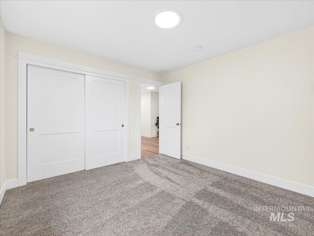 1611 Regency Way Emmett, ID 83617 - Photo 38 of 47 Unfurnished bedroom with a closet and carpet floors