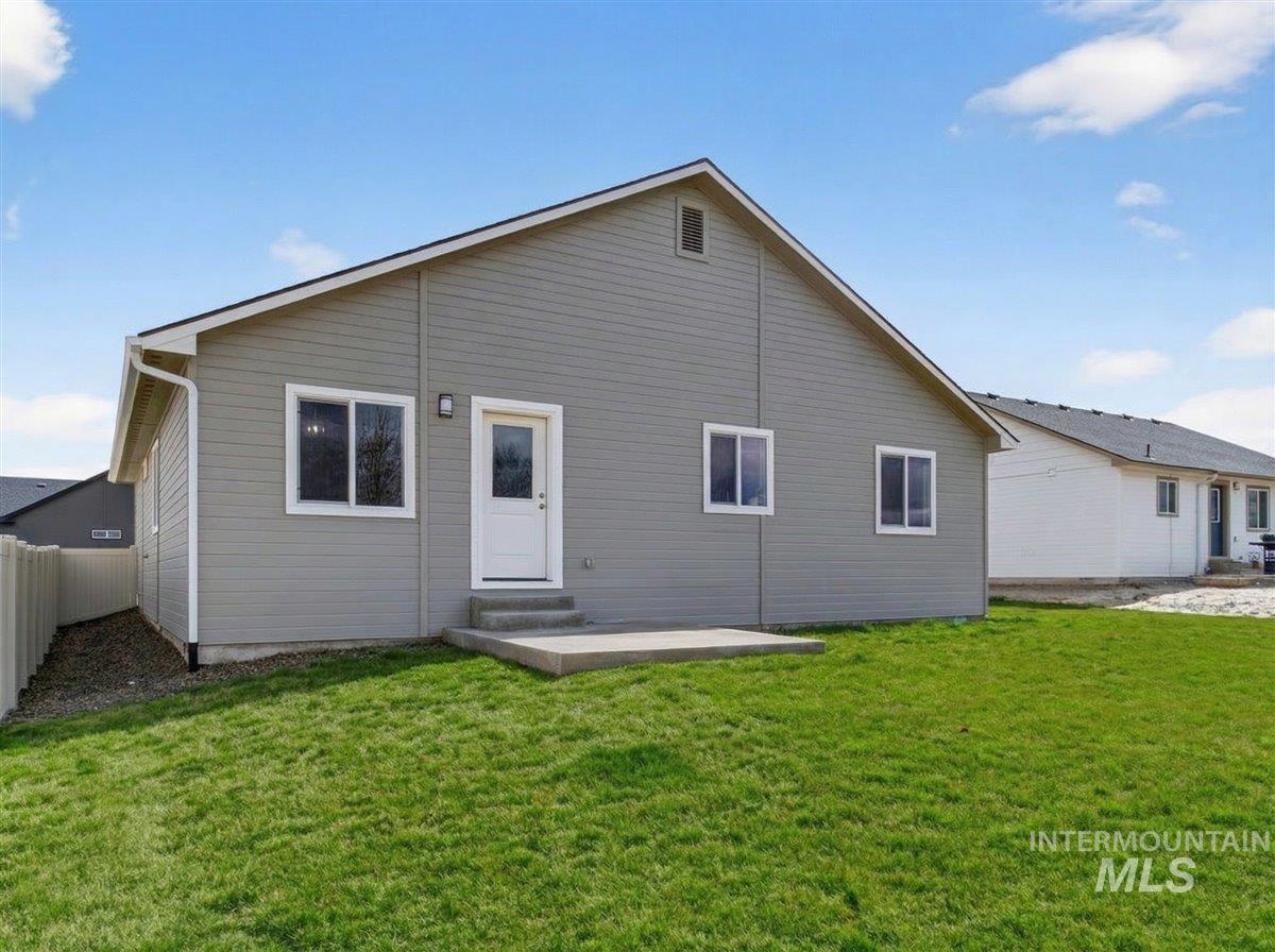 1611 Regency Way Emmett, ID 83617 - Photo 40 of 47 Rear view of house featuring a patio, a yard, and entry steps