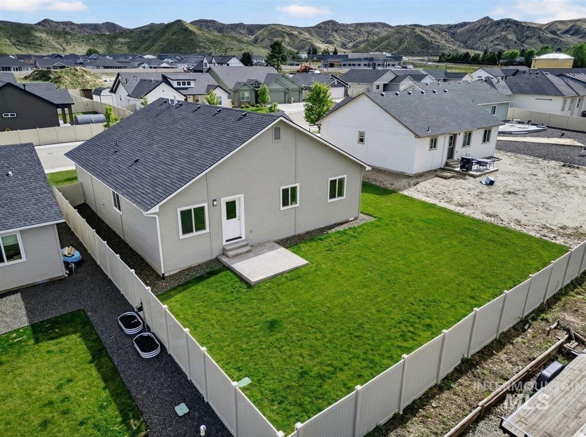 1611 Regency Way Emmett, ID 83617 - Photo 42 of 47 Aerial perspective of suburban area with mountains
