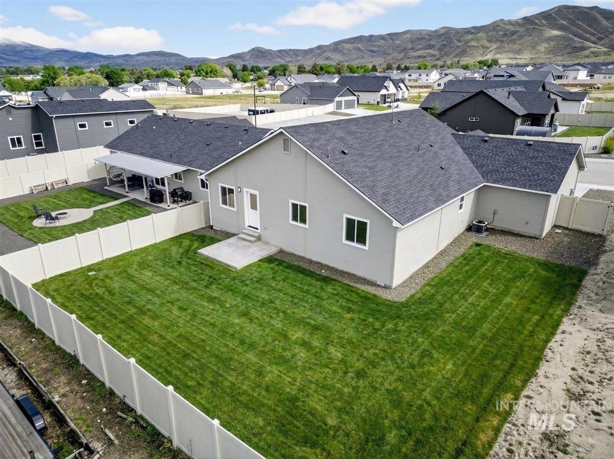 1611 Regency Way Emmett, ID 83617 - Photo 43 of 47 Aerial perspective of suburban area with a mountain backdrop