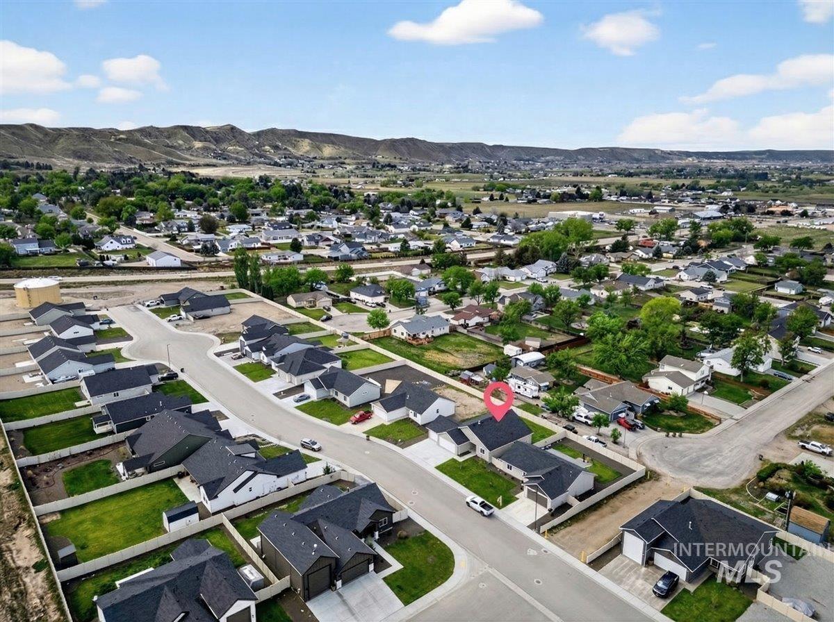 1611 Regency Way Emmett, ID 83617 - Photo 45 of 47 Aerial perspective of suburban area with a mountain backdrop