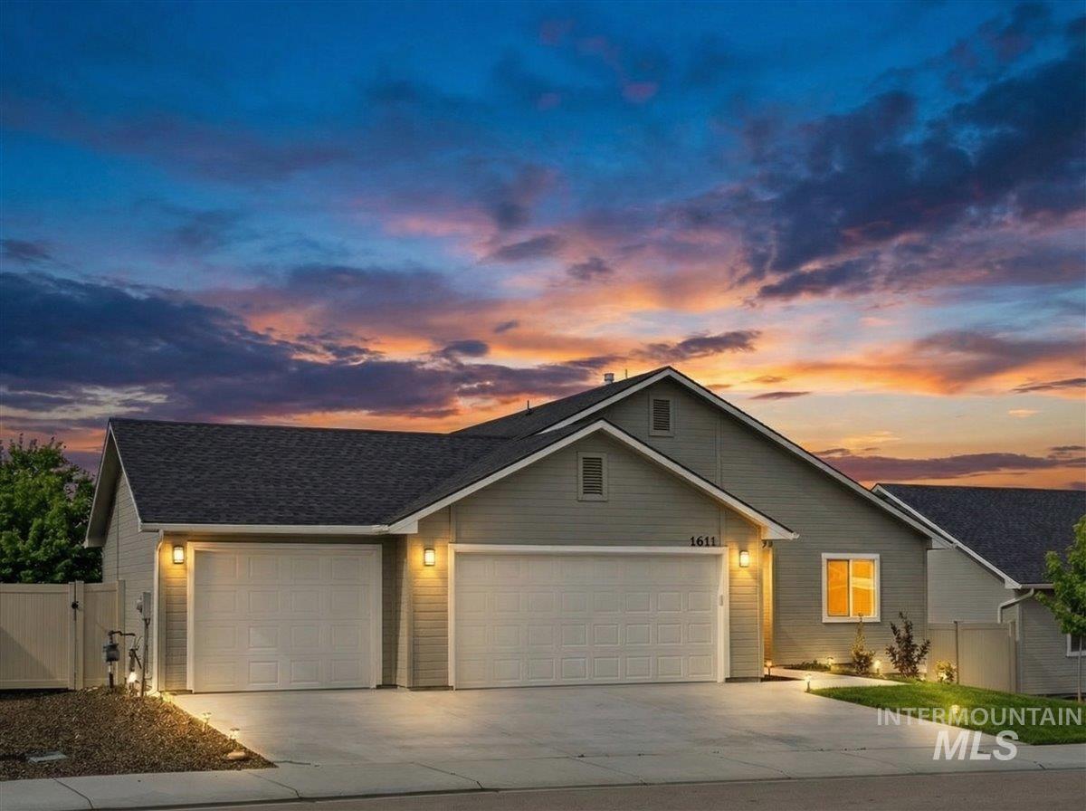 1611 Regency Way Emmett, ID 83617 - Photo 46 of 47 View of front of house featuring a garage, driveway, a gate, and roof with shingles