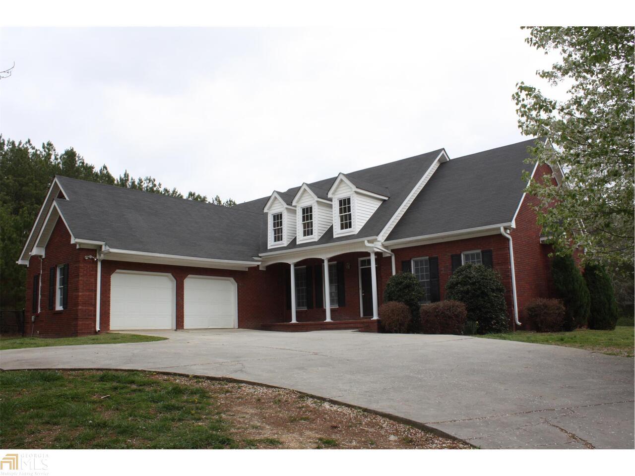 175 Sheep Leg Road Rockmart, GA 30153 - Photo 1 of 1 a front view of a house with a yard