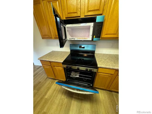 a view of a kitchen from the hallway