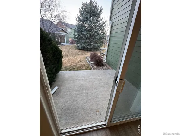 a view of a hallway with stairs