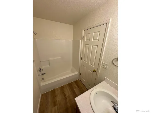 a view of bedroom and hallway