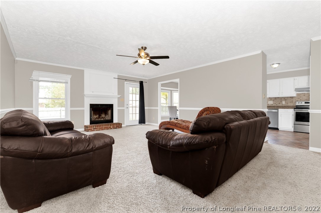 709 Riyhad Road Fayetteville, NC 28314 - Photo 15 of 29 a living room with furniture and a fireplace