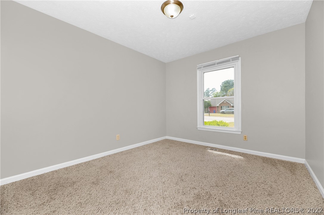 709 Riyhad Road Fayetteville, NC 28314 - Photo 23 of 29 an empty room with windows