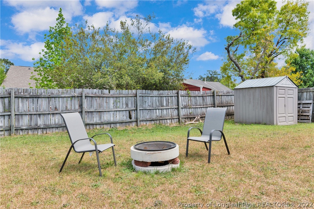 709 Riyhad Road Fayetteville, NC 28314 - Photo 29 of 29 a view of a chairs and table in backyard