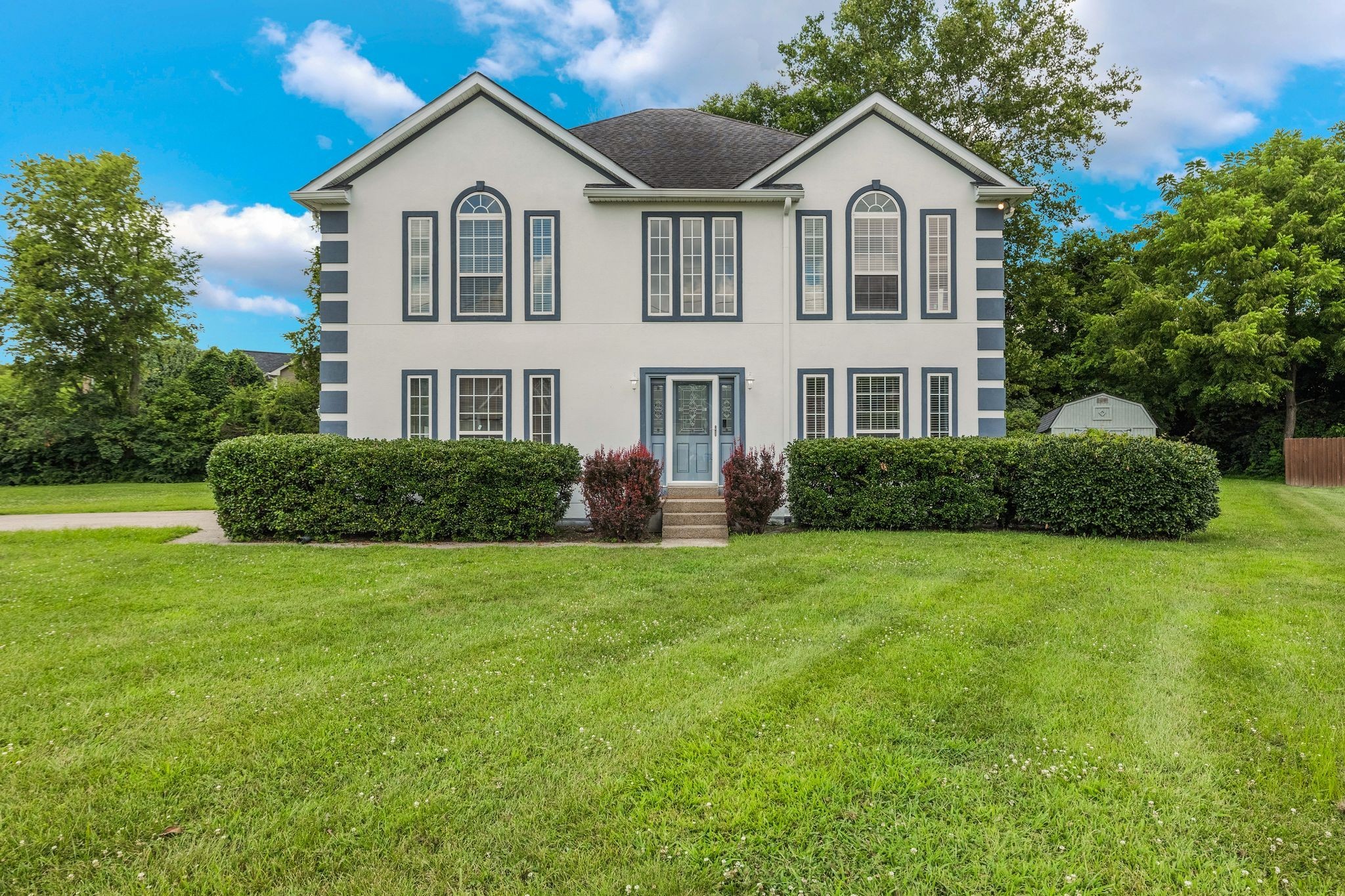 1757 Shane Drive Spring Hill, TN 37174 - Photo 1 of 30 a front view of a house with a yard and trees