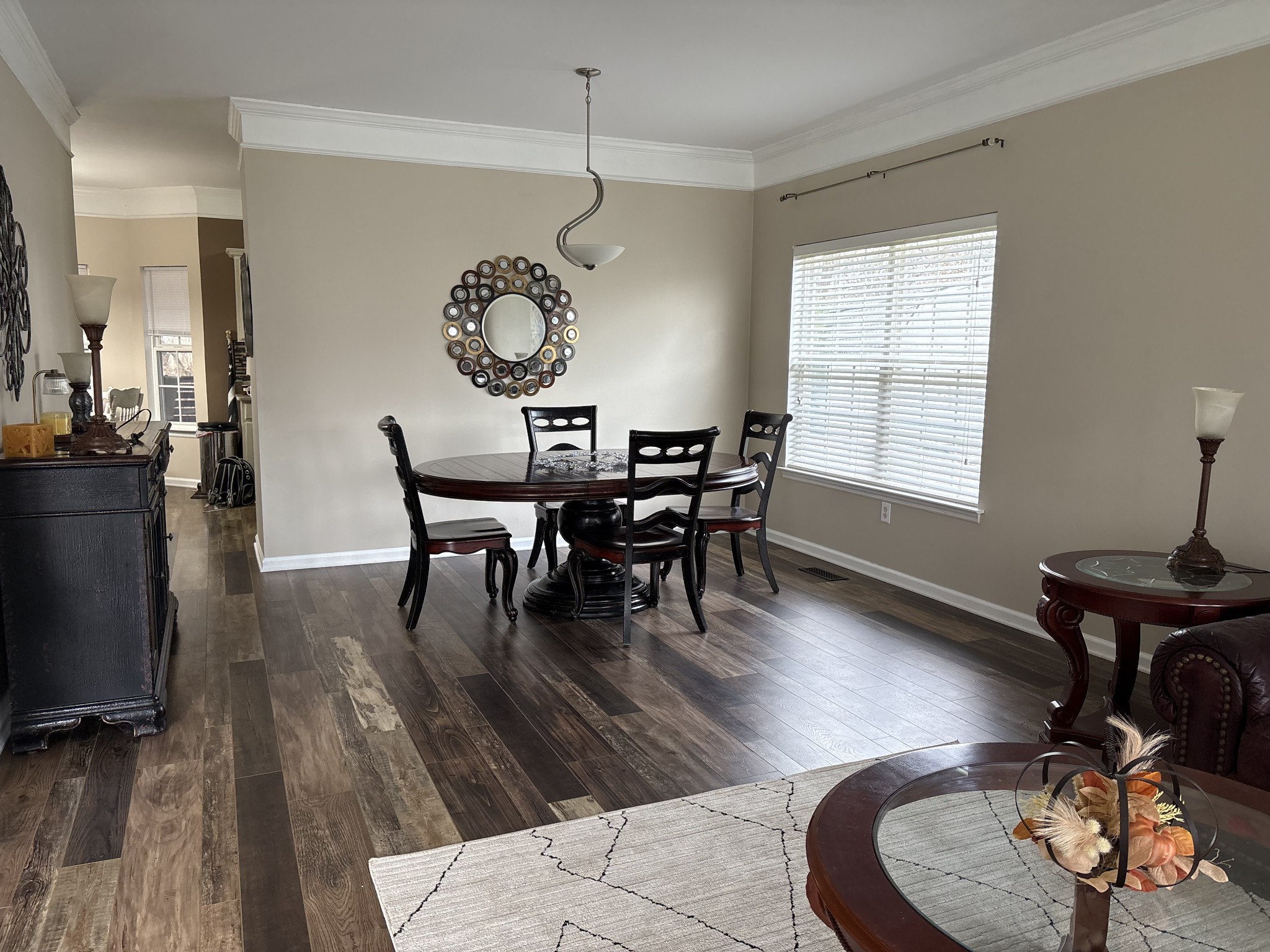 1757 Shane Drive Spring Hill, TN 37174 - Photo 13 of 30 a dining room with wooden floor a chandelier a wooden table and chairs