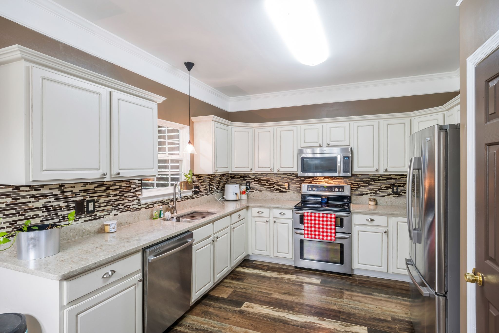 1757 Shane Drive Spring Hill, TN 37174 - Photo 25 of 30 a kitchen with stainless steel appliances sink cabinets and window