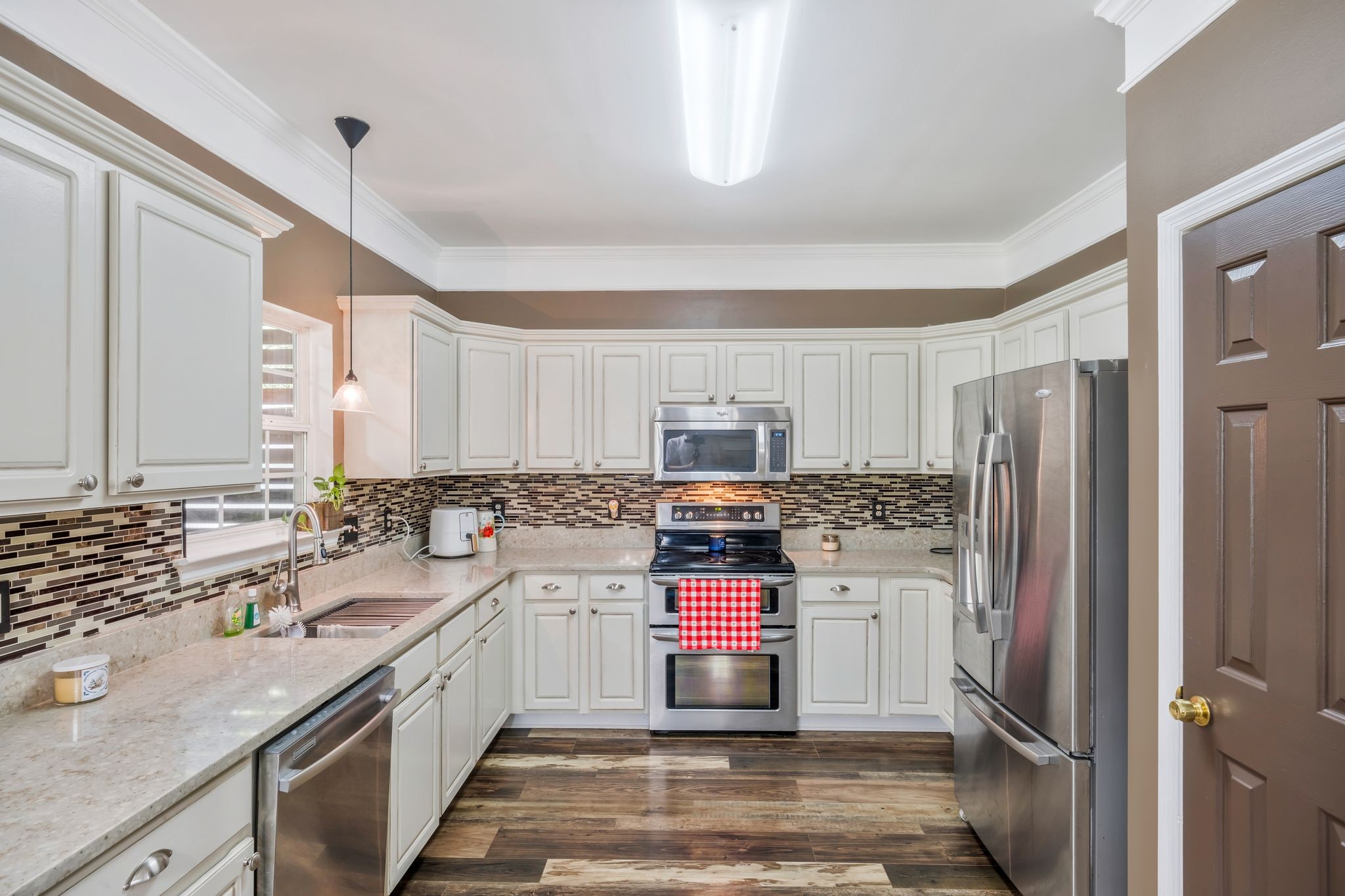 1757 Shane Drive Spring Hill, TN 37174 - Photo 26 of 30 a kitchen with a sink stove and refrigerator