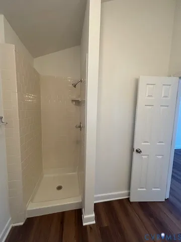 an empty room with wooden floor