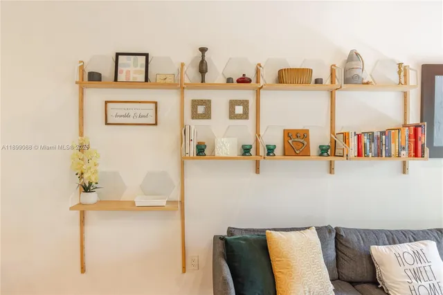 a bedroom with a bed and a potted plant