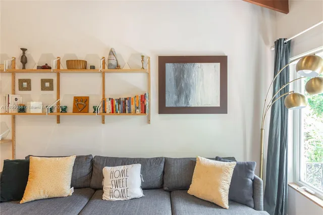 a kitchen with stainless steel appliances a dining table chairs and chandelier