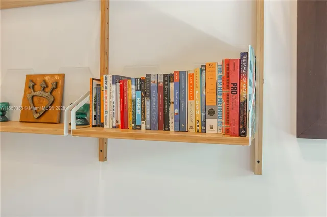 a kitchen with stainless steel appliances granite countertop a sink and a refrigerator