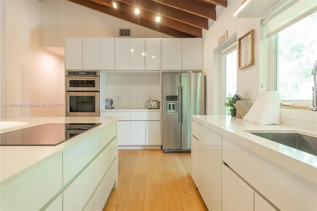 a view of a hallway with washer and dryer