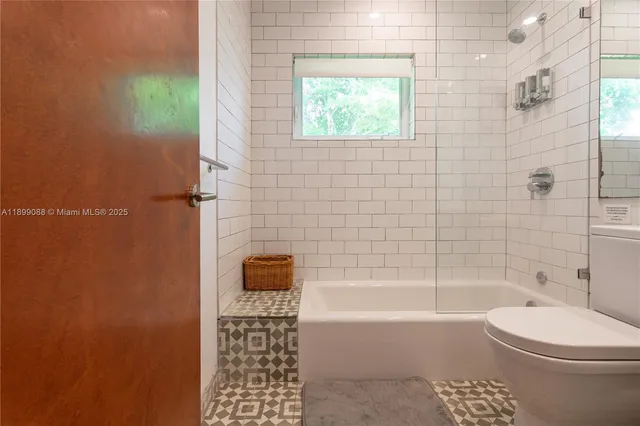 a bedroom with a bed and a chair