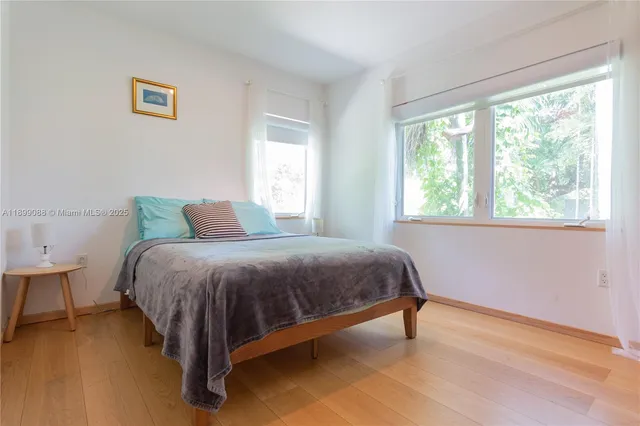 a bedroom with a bed and a closet