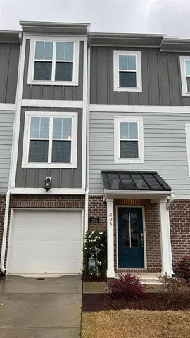 a front view of a house with a garage