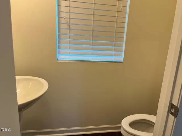 a bathroom with a toilet and a sink