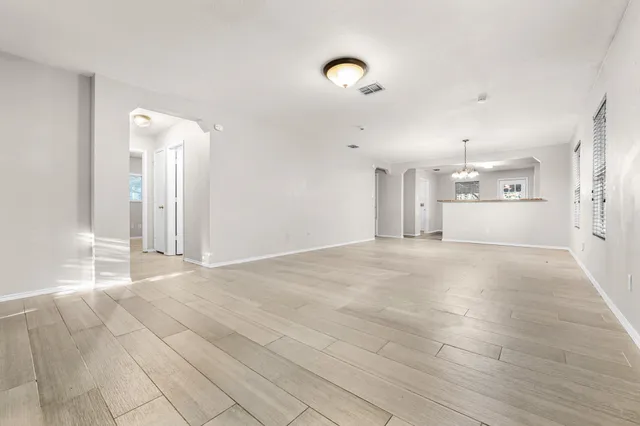 a kitchen with a center island and stainless steel appliances