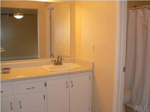 6045 Hilburn Road Pensacola, FL 32504 - Photo 13 of 18 Master bath has great tile floors and large dressing area.