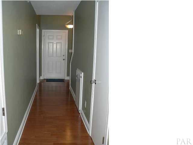 6045 Hilburn Road Pensacola, FL 32504 - Photo 3 of 18 Hallway entrance has attractive wood laminate flooring.