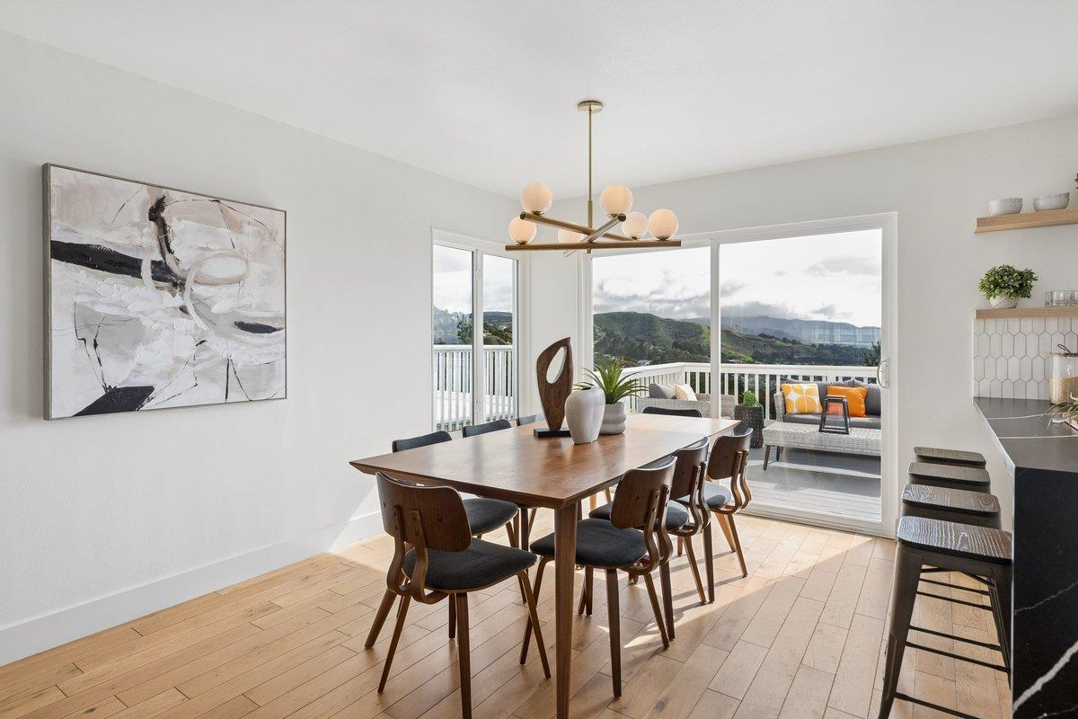 170 Beachview Avenue Pacifica, CA 94044 - Photo 40 of 85 a view of a dining room with furniture wooden floor and chandelier