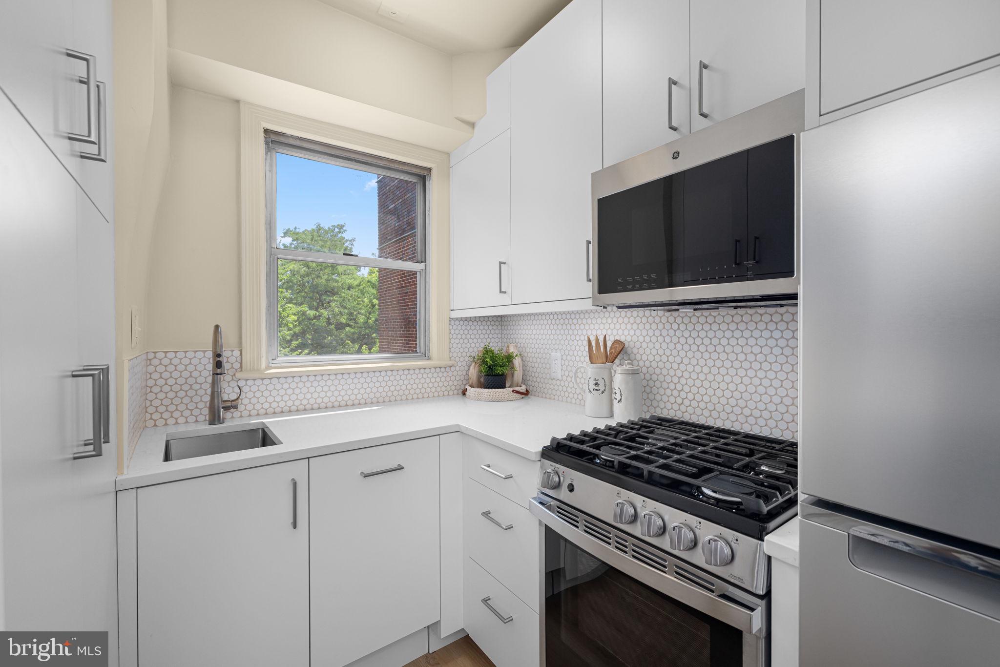 2500 Q Street Northwest, Unit 410 Washington, DC 20007 - Photo 9 of 31 Well Designed Kitchen with Ample Cabinetry
