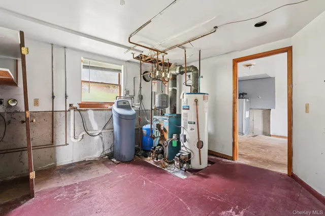 a view of an empty room with a fireplace