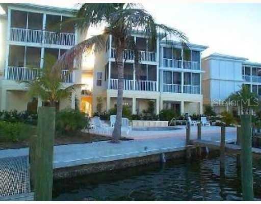 9209 Midnight Pass Road, Unit 5 Sarasota, FL 34242 - Photo 1 of 1 Step out your door and on to your private boat dock and community pool