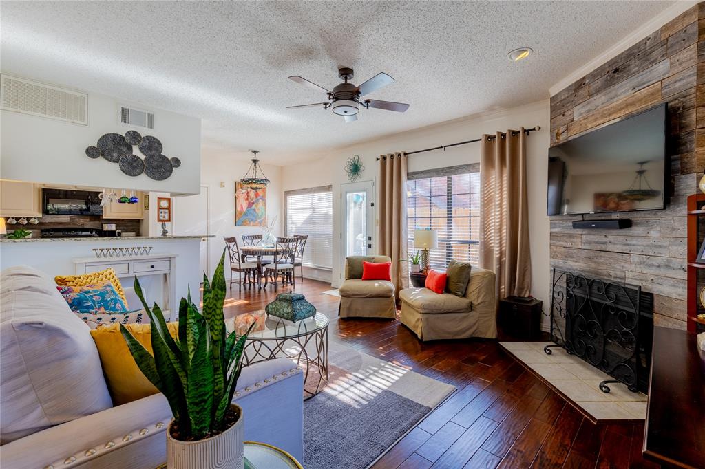 5619 Preston Oaks Road, Unit 502 Dallas, TX 75254 - Photo 1 of 33 a living room with furniture fireplace and flat screen tv