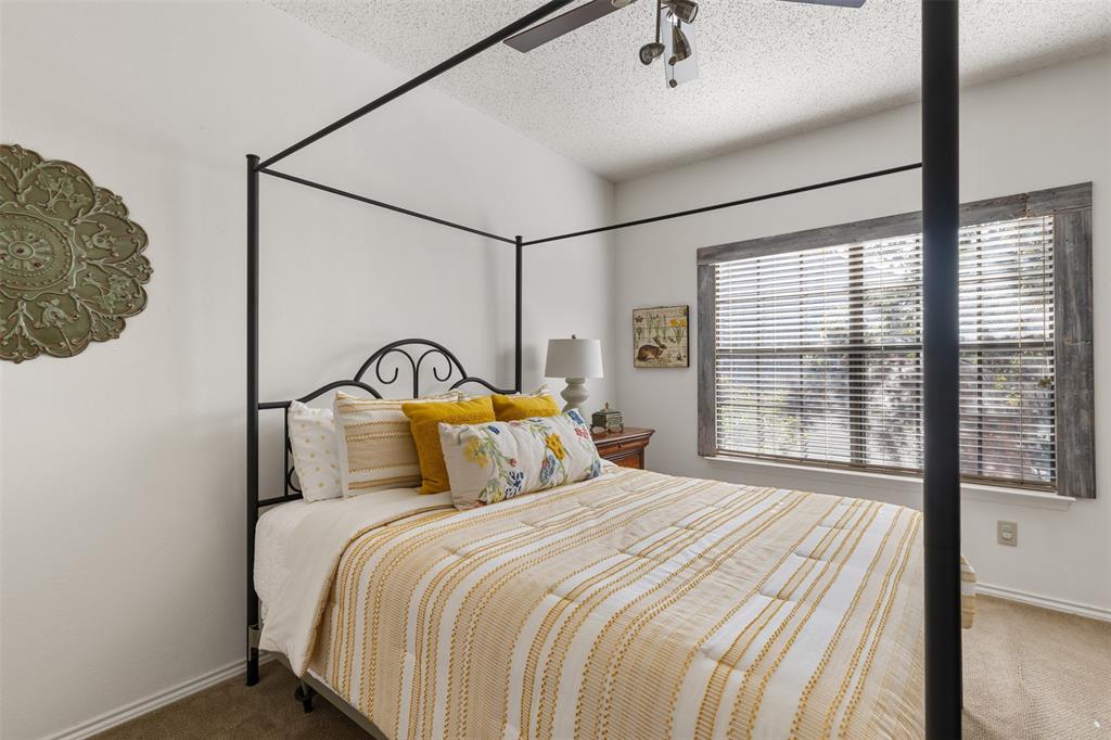 5619 Preston Oaks Road, Unit 502 Dallas, TX 75254 - Photo 14 of 33 a bedroom with a bed and a window