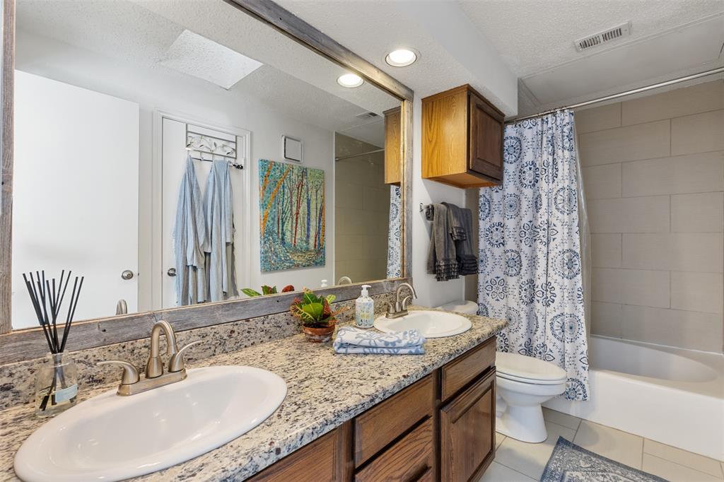 5619 Preston Oaks Road, Unit 502 Dallas, TX 75254 - Photo 17 of 33 a bathroom with a granite countertop sink toilet and shower
