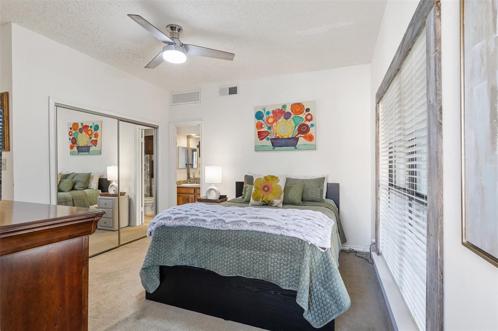 5619 Preston Oaks Road, Unit 502 Dallas, TX 75254 - Photo 21 of 33 a bedroom with a bed and furniture