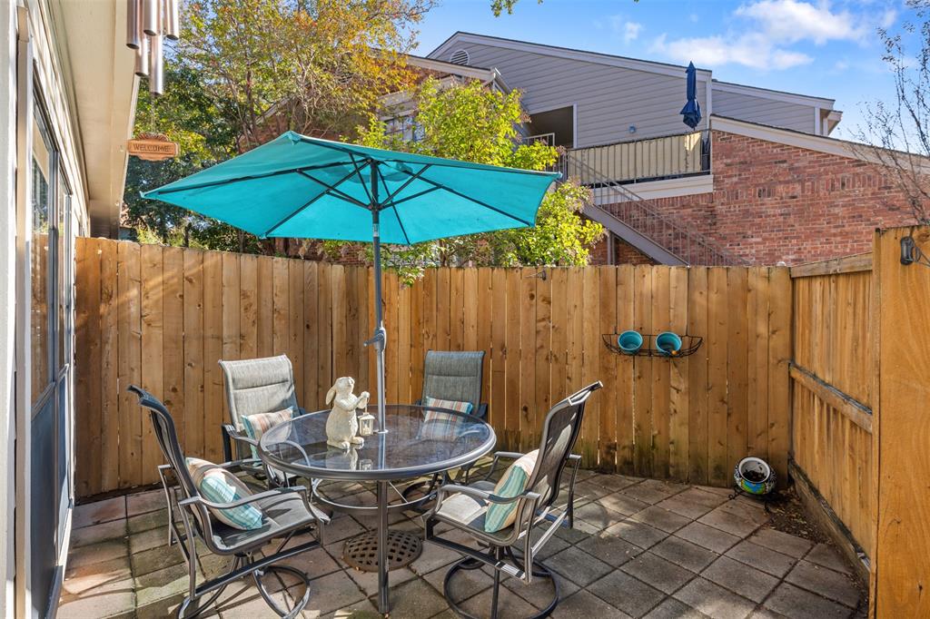5619 Preston Oaks Road, Unit 502 Dallas, TX 75254 - Photo 24 of 33 a patio with a table and chairs