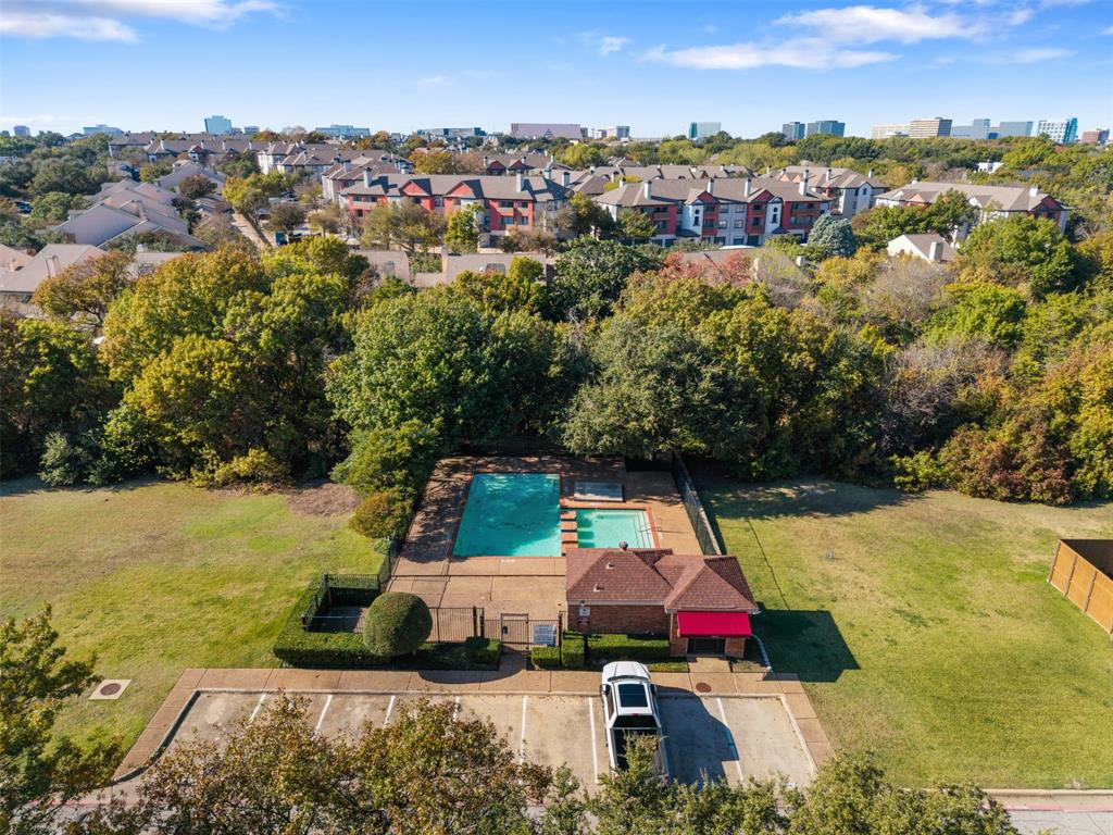 5619 Preston Oaks Road, Unit 502 Dallas, TX 75254 - Photo 26 of 33 an aerial view of residential houses with outdoor space and swimming pool
