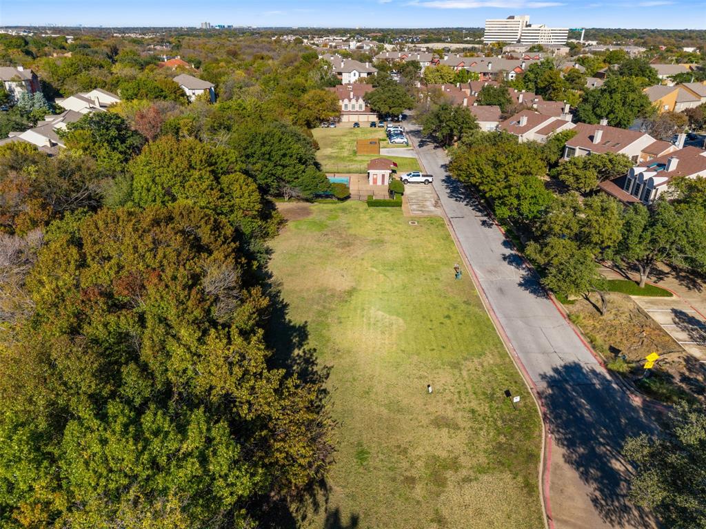 5619 Preston Oaks Road, Unit 502 Dallas, TX 75254 - Photo 28 of 33 a view of a yard with swimming pool