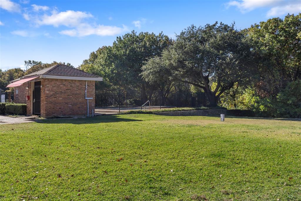 5619 Preston Oaks Road, Unit 502 Dallas, TX 75254 - Photo 29 of 33 a view of a house with a yard
