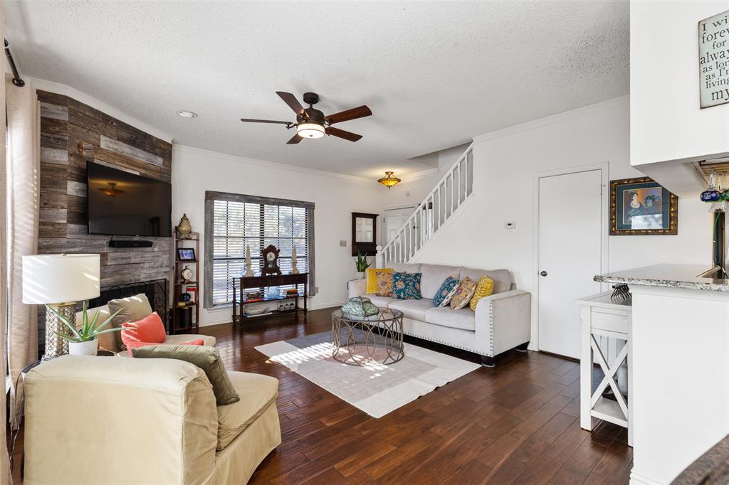 5619 Preston Oaks Road, Unit 502 Dallas, TX 75254 - Photo 3 of 33 a living room with furniture a flat screen tv and kitchen view