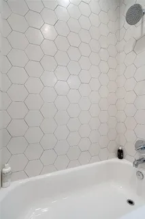 a view of a hallway with washer and dryer